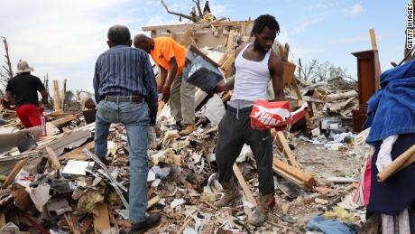 Residents recover possessions from homes that were destroyed by the March 24 tornado in Rolling Fork, Mississippi. 