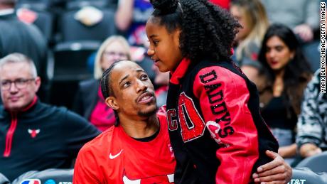 DeMar DeRozan embraces his daughter Diar before the game against the Toronto Raptors