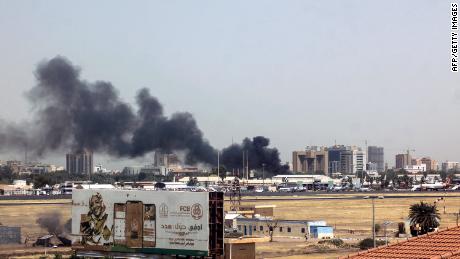 Heavy smoke bellows above buildings in the vicinity of the Khartoum&#39;s airport on April 15, 2023, amid clashes in the Sudanese capital.