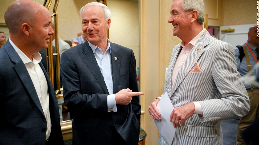 Utah Gov. Spencer Cox, left, and Hutchinson chat with New Jersey Gov. Phil Murphy at the National Governors Association meeting in Portland, Maine, in July 2022.