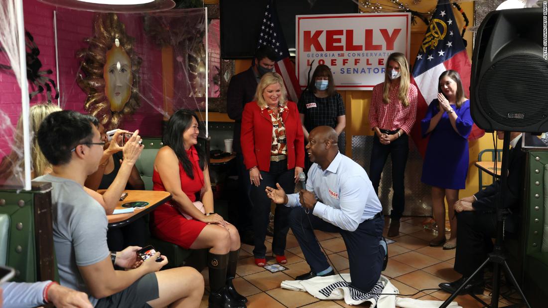 Scott pleads with a supporter to vote for US Sen. Kelly Loeffler during a campaign event in Doraville, Georgia, in October 2020.