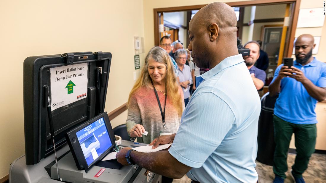 Scott submits his ballot during early voting in Hanahan, SC in October 2022. He was once again reelected.