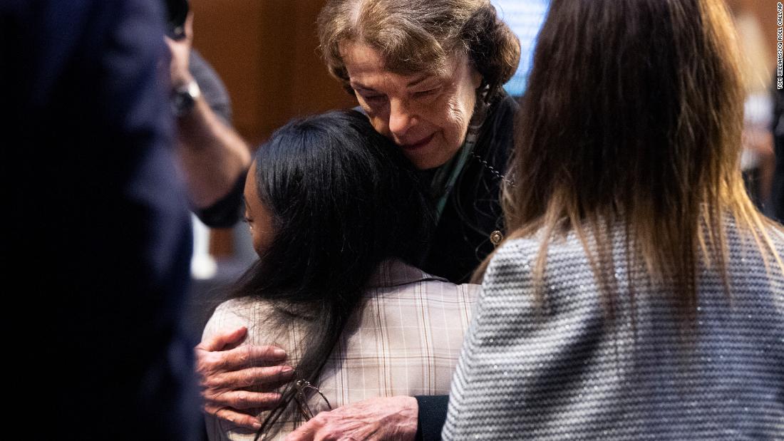 Feinstein hugs US Olympic gymnast Simone Biles after a Senate Judiciary Committee hearing on the FBI&#39;s handling of the Larry Nassar investigation in 2021. Gymnasts Aly Raisman, Maggie Nichols and McKayla Maroney also testified.