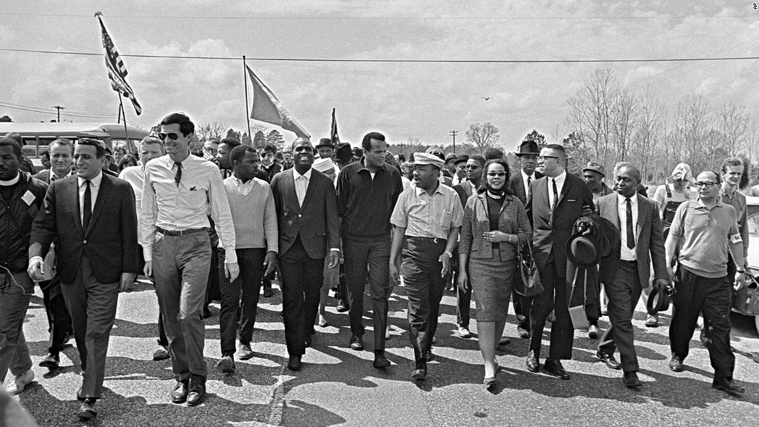 Belafonte, center, marches with Martin Luther King Jr. and others near the Alabama State Capitol in Montgomery in 1965.