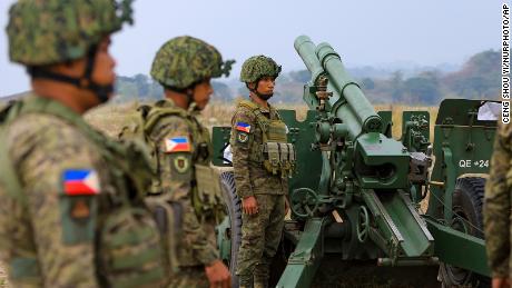 Filipino soldiers prepare for shelling during a combined field artillery live-fire exercise as part of the US-Philippines Balikatan military exercises, amid growing threats from China, near New Clark City, Philippines, on April 14.
