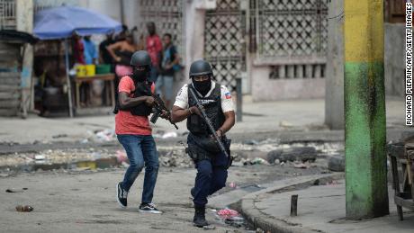 Police officers patrol a neighborhood amid gang-related violence in downtown Port-au-Prince on April 25, 2023.