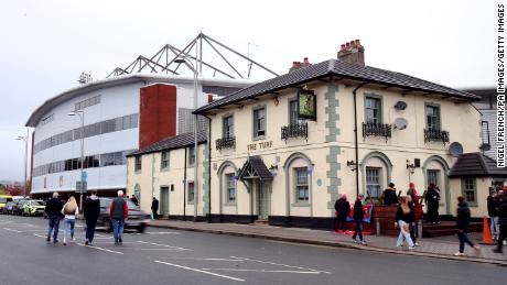 The Turf pub is a must-see for Wrexham fans. Here fans are pictured outside the venue ahead of an FA Cup tie in November 2022. 