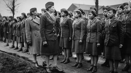 Maj. Charity E. Adams, center left, and Capt. Abbie N. Campbell inspect the first contingent of Black members of the Women&#39;s Army Corps -- the 6888 the Central Postal Directory Battalion -- somewhere in England.