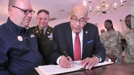 Retired Lt. Gen. Arthur J. Gregg signs the Gregg-Adams Club guestbook following the unveiling April 19 of the outside sign at the newly named Gregg-Adams Club. The ledger, which is at least 40 years old, still had Gregg&#39;s signature and other information from the day he retired there in 1981. Gregg shares the new name with Lt. Col. Charity Adams Earley, who commanded a postal unit in an overseas theater of operations during World War II.