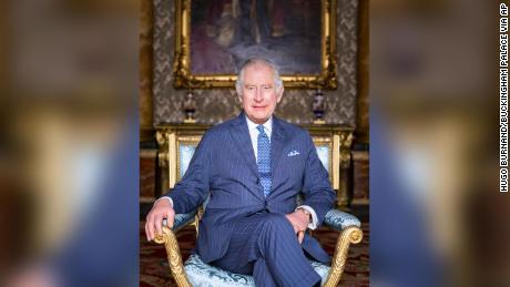 King Charles III poses for a photograph in the Blue Drawing Room at Buckingham Palace, London. 