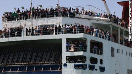 Evacuees travel across the Red Sea from Port Sudan to the Saudi King Faisal navy base in Jeddah, on Saturday. The UN&#39;s refugee agency warned over 800,000 people may flee as a result of the violence. 