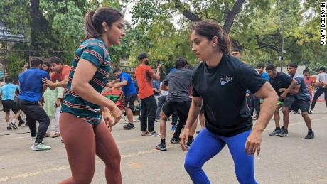 Vinesh Phogat, right, comes from a well-known wrestling family in India.