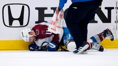 Cogliano is tended to by medical staff during Game 6 against the Seattle Kraken.