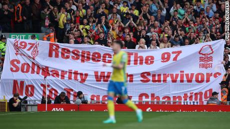 Nottingham Forest fans hold up a banner in memory of the 97 victims of the Hillsborough disaster.