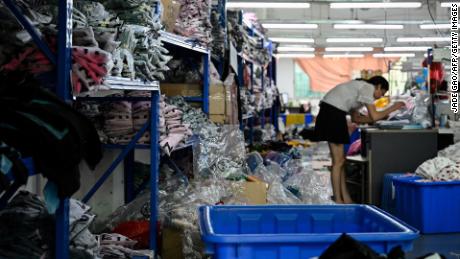 A worker makes clothes at a garment factory that supplies SHEIN, a cross-border fast fashion e-commerce company in Guangzhou, in Chinas southern Guangdong province on July 18, 2022.