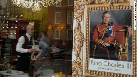 A cafe in London displays a poster to celebrate the coronation of King Charles III.