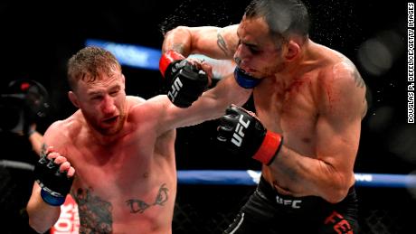 Gaethje (left) punches Tony Ferguson in their Interim lightweight title fight during UFC 249 on May 9, 2020.