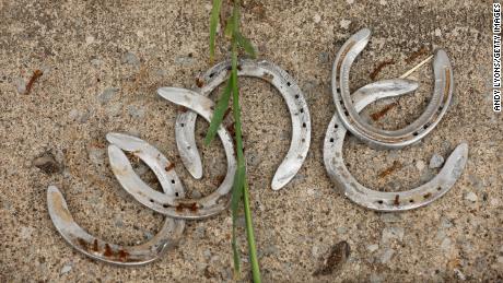 Discarded horse shoes are seen in the barn area during the morning training for the Kentucky Derby at Churchill Downs on April 29, 2023. 