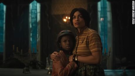 &quot;Haunted Mansion,&quot; featuring Rosario Dawson (R) and Chase Dillon.