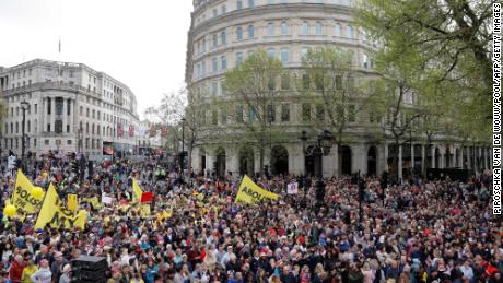 Protesters hold up placards saying &quot;Not My King&quot; and &quot;Abolish the Monarchy&quot; in Trafalgar Square, close to Westminster Abbey in central London on May 6, 2023.