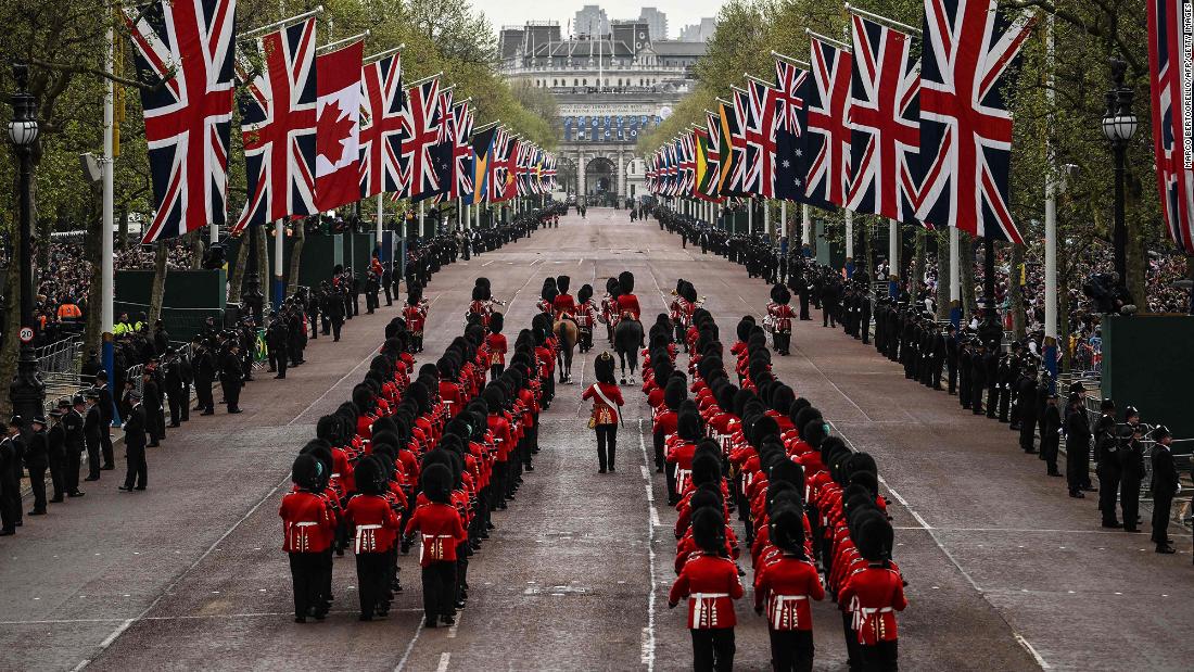 Members of the Coldstream Guards march on the procession route before the coronation.