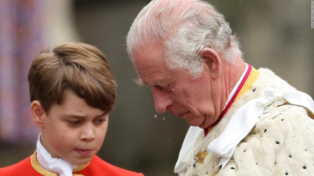 The King is seen near his grandson Prince George, one of his pages of honor.