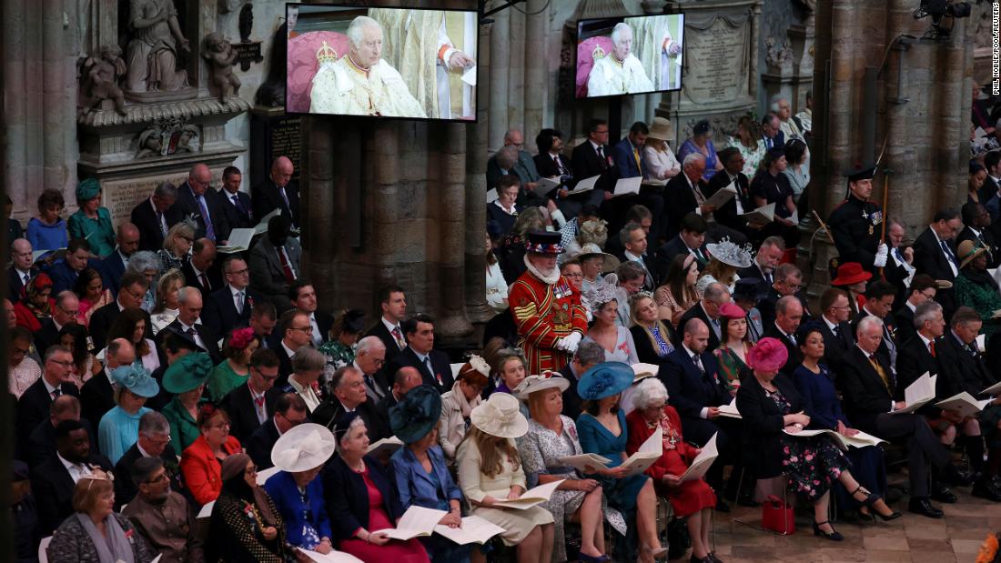 Guests watch the coronation ceremony at Westminster Abbey.