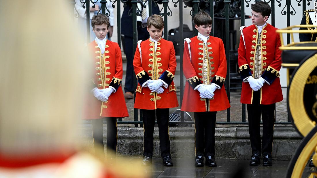 Prince George, second from left, stands with other pages of honor at Westminster Abbey.