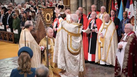 King Charles III sits as he receives The St Edward&#39;s Crown during the coronation ceremony at Westminster Abbey, London, Saturday, May 6, 2023. (Jonathan Brady/Pool Photo via AP)