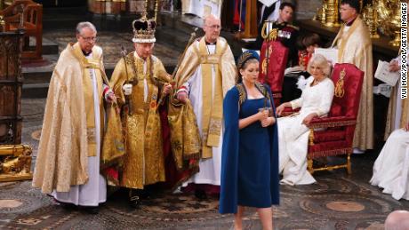Penny Mordaunt leads King Charles III during his coronation ceremony in Westminster Abbey.