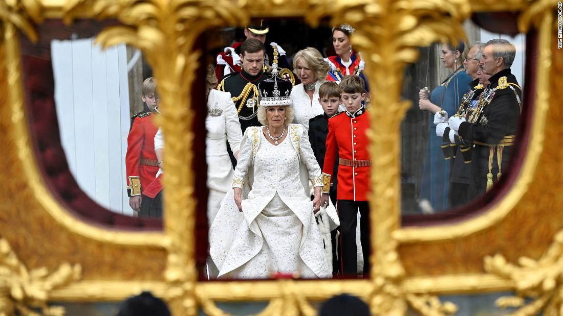 The Queen walks toward the Gold State Coach after leaving Westminster Abbey.