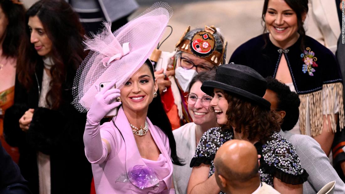 Singer Katy Perry takes a selfie with guests at Westminster Abbey. The coronation guests included &lt;a href=&quot;https://www.cnn.com/uk/live-news/king-charles-iii-coronation-ckc-intl-gbr/h_6381e2bc126c139f48714994a44b7510&quot; target=&quot;_blank&quot;&gt;celebrities and world leaders&lt;/a&gt;.