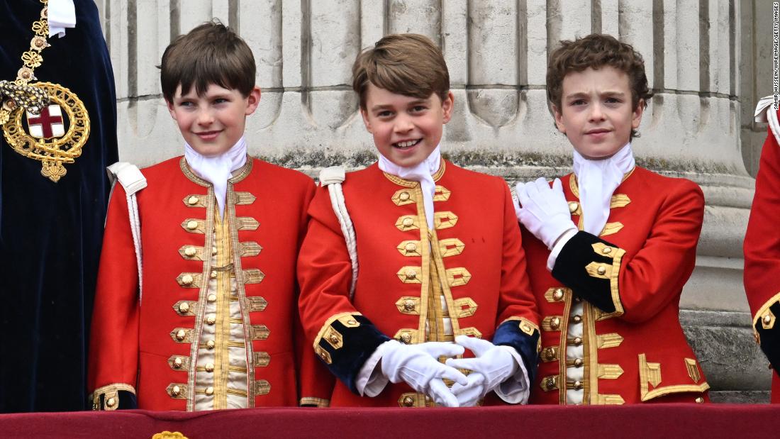 The King&#39;s eldest grandson, Prince George, stands on the palace balcony between two other boys who like him served as pages of honor for the coronation: Oliver Cholmondeley, left, and Nicholas Barclay.