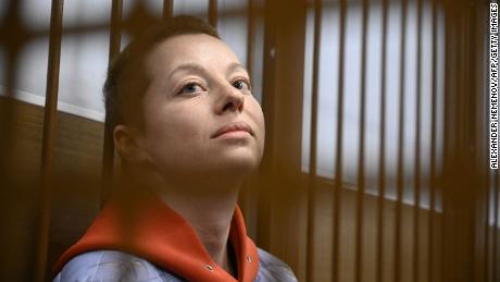 Yevgenia Berkovich sits inside a defendants&#39; cage during her remand hearing in Moscow.