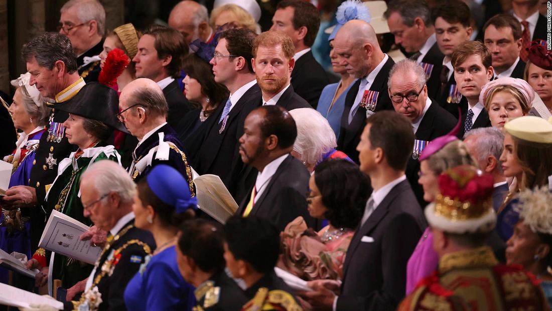 Prince Harry looks around Westminster Abbey from his spot in the third row. He is a non-working royal and did not perform any duties during the ceremony.