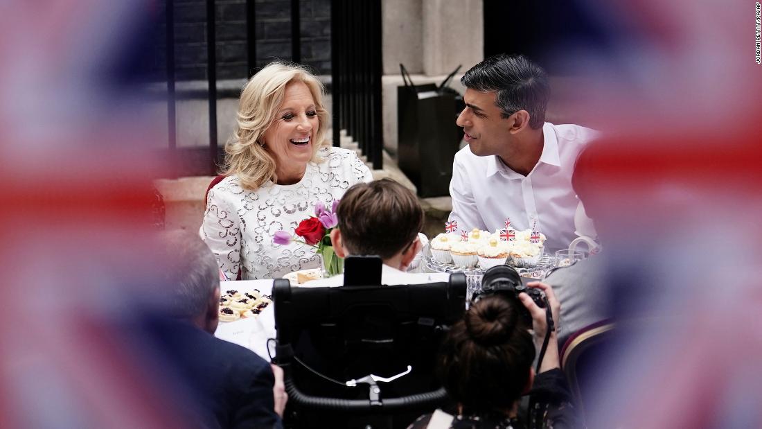 US first lady Jill Biden and British Prime Minister Rishi Sunak speak during a &quot;Coronation Big Lunch&quot; event on Downing Street.