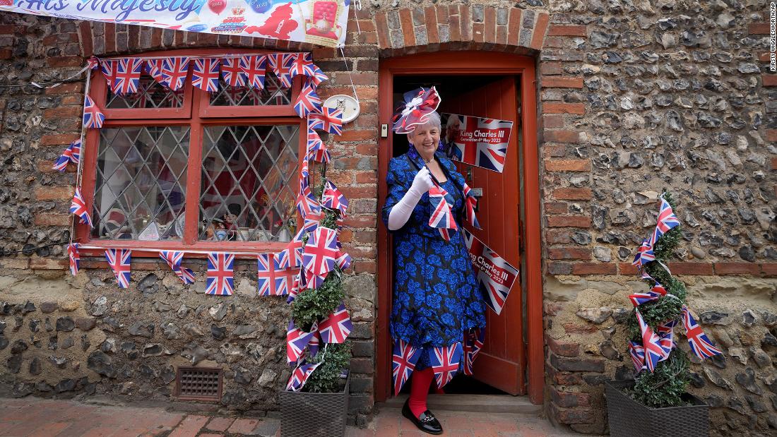 Sylvia Daw leaves her cottage to celebrate in Alfriston, England.