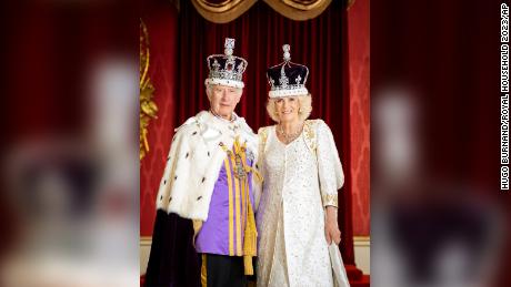 In this photo made available by Buckingham Palace on Monday, May 8, 2023, King Charles III and Queen Camilla are pictured in the Throne Room at Buckingham Palace, London. (Hugo Burnand/Royal Household 2023 via AP)