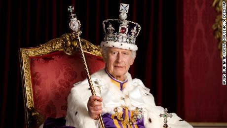 In this photo made available by Buckingham Palace on Monday, May 8, 2023, Britain&#39;s King Charles III poses for a photo in full regalia in the Throne Room, London. 