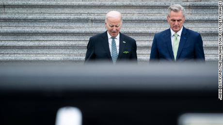 President Joe Biden walks with House Speaker Kevin McCarthy as he departs following the annual St. Patrick&#39;s Day luncheon on Capitol Hill on Friday, March 17, in Washington, DC. 