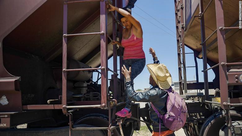 A woman is helped off a freight train after she became too scared to climb down from the roof on Sunday, May 7. &lt;a href=&quot;https://www.cnn.com/2023/05/08/americas/mexico-migrants-border-train/index.html&quot; target=&quot;_blank&quot;&gt;Migrants have been traveling on top of freight trains&lt;/a&gt; as they headed north from southern Mexico. The woman&#39;s son, Leonardo Luzardo, told CNN it had been a long, cold night atop the train, feeling like their bodies were turning to ice. &quot;It seemed like we were going to freeze,&quot; he said.