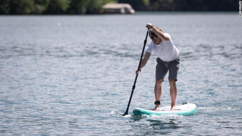 This self-inflating paddleboard provides its own power