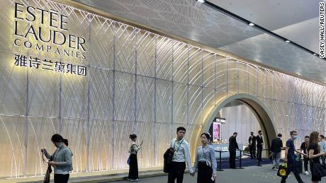People walking past an Estée Lauder booth at an expo in Haikou, capital of Hainan island, in April.