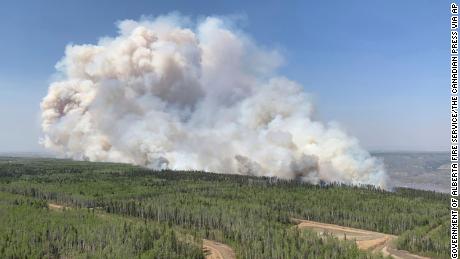 A wildfire burns a section of forest in the Grande Prairie district of Alberta, Canada, Saturday, May 6, 2023.