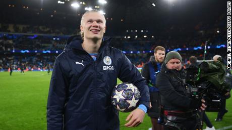 Haaland holds the match ball after scoring five against RB Leipzig in the Champions League in March. 