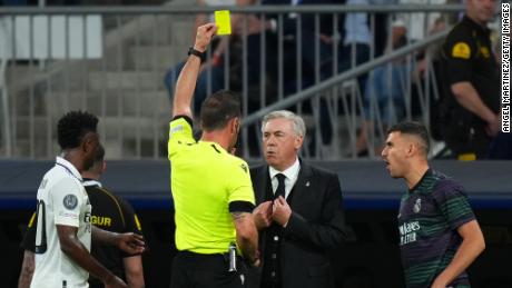 Ancelotti is yellow carded on the sidelines against Manchester City. 