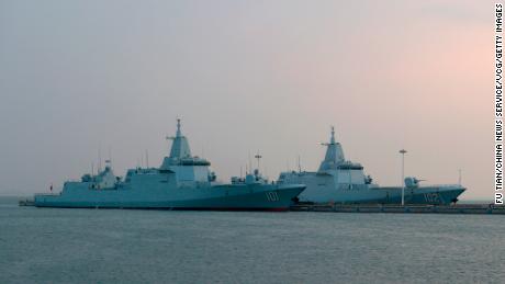 Type 055 guided-missile destroyers Nanchang (101) and Lhasa (102) at China&#39;s Qingdao port on  April 20, 2023.