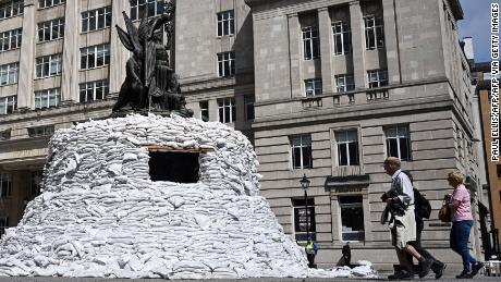 &quot;Protect the Beats,&quot; an art installation by Ukranian musician Denys Kashchei, encased Nelson&#39;s monument in Liverpool with sandbags. 