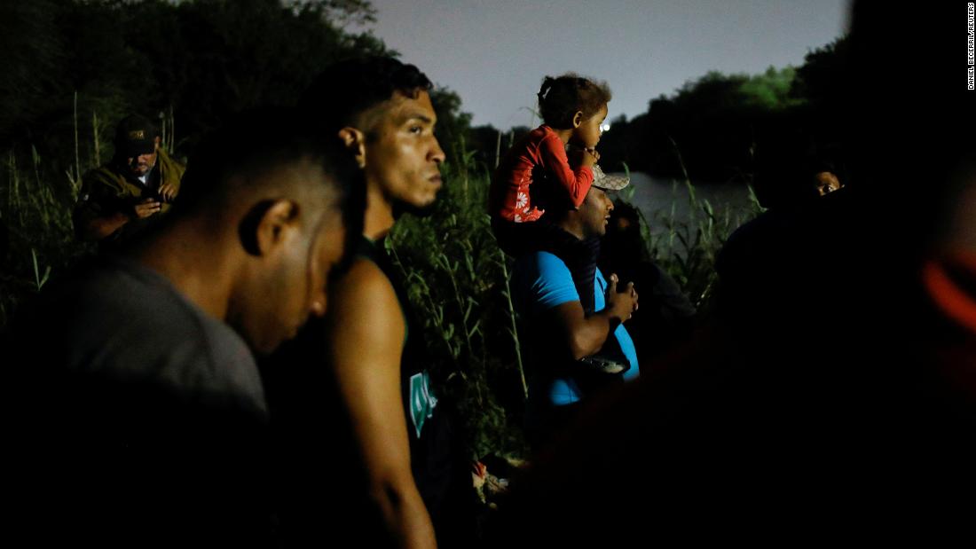 Migrants in Matamoros, Mexico, gather on the banks of the Rio Grande as they get ready to cross the border to turn themselves in on May 11.