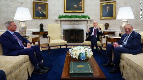 Speaker of the House Kevin McCarthy and Senate Majority Leader Sen. Chuck Schumer listen as President Joe Biden before a meeting on the debt limit in the Oval Office of the White House on Tuesday in Washington, DC. 